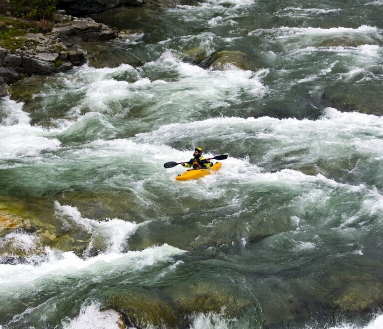 beautiful-scenery-rafting-mountain-river-stream-flowing-down-huge-stones_181624-29112