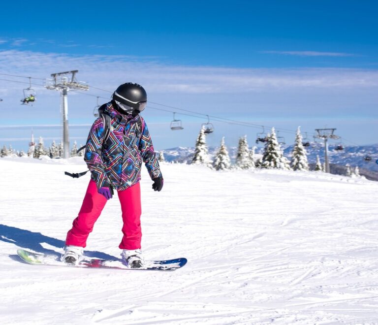 girl-learning-snowboard-mountain-resort-with-ski-lift-background_181624-49756