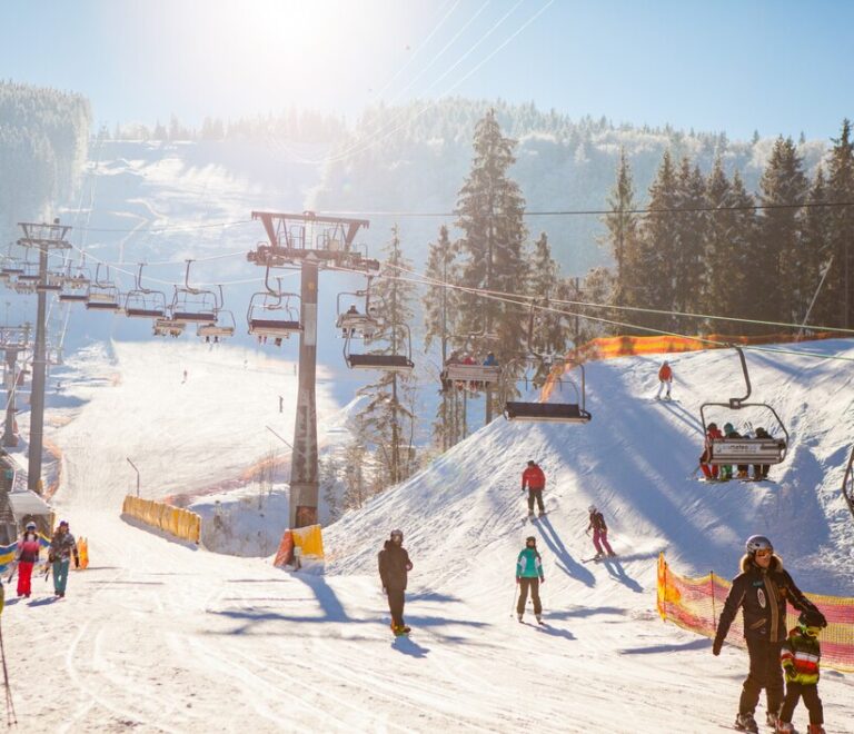 skiers-ski-lift-riding-up-ski-resort_155003-5864